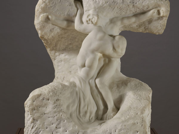 A marble sculpture by Auguste Rodin showing two figures representing Christ and Mary Magdalene.